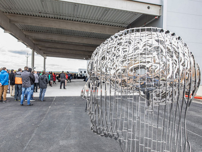 Sculpture by artist David Černy in front of the new logistics centre
