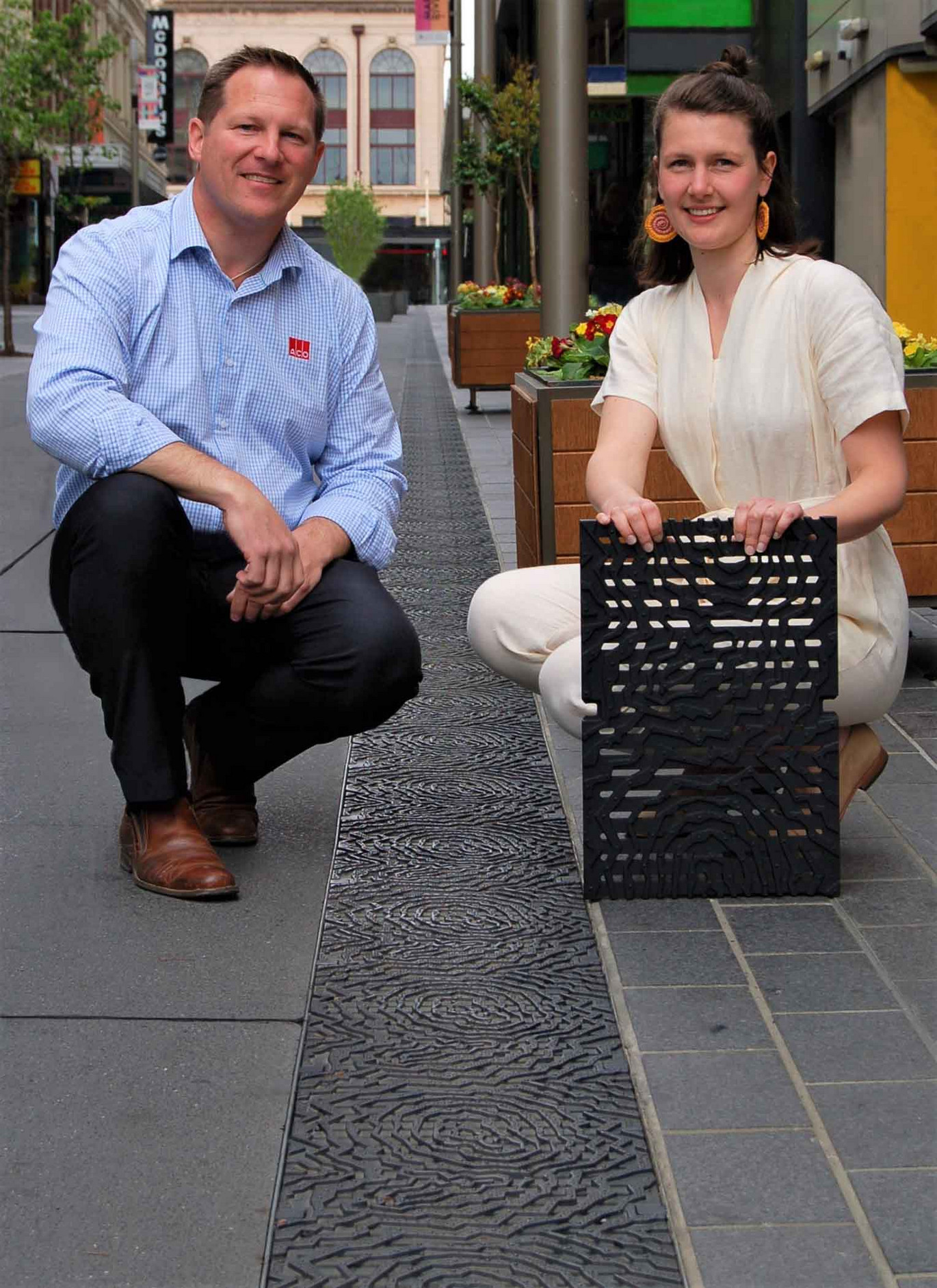 Philip Edwards and Amy Joy Watson from ACO Australia with the non-slip geode design grating
