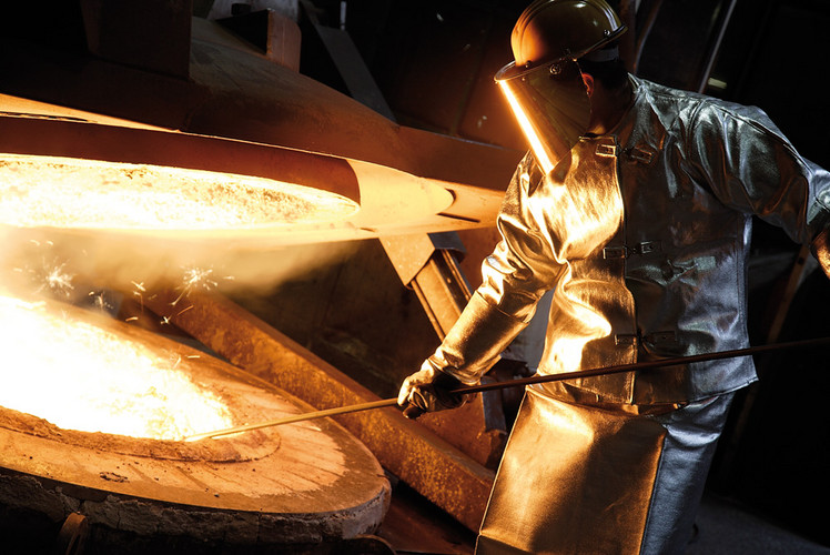 Worker at a casting furnace